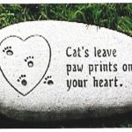 Granite pet memorial headstone with cat engraving and “Cats leave paw prints” remembrance quote.