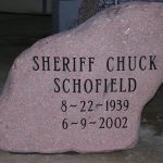 Gray granite double upright headstone monument with polished face for a family cemetery memorial.