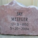 Gray granite double headstone monument with polished finish for a shared family cemetery memorial.
