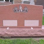 Gray granite double headstone monument with polished face for a shared family cemetery memorial.