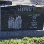 Gray granite double upright headstone with polished face for a shared cemetery memorial.