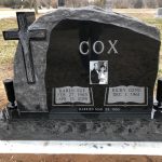 Gray granite upright headstone monument with polished face and engraved memorial lettering.