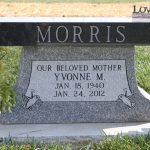 Granite grave marker for Yvonne M. Morris, with dates Jan 18, 1940 – Jan 24, 2012, and decorative doves.